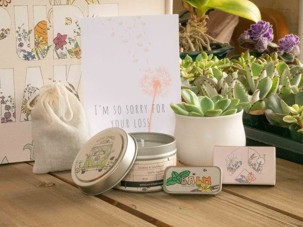 I'm so sorry for your loss Succulent Gift Box with candle, custom matches, lavender sachet and lip balm, in front of a decorative gift box