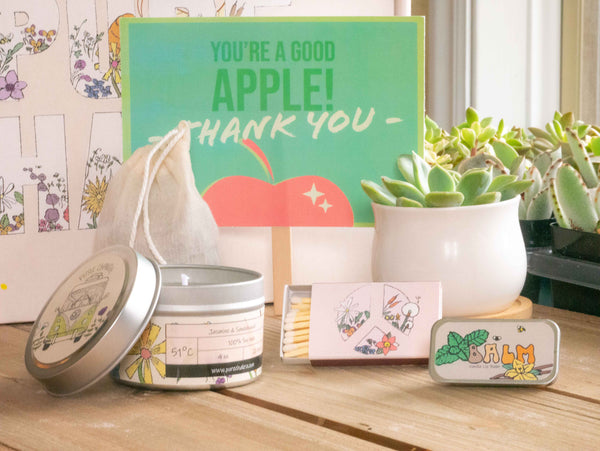 You're a good apple! - thank you- Succulent Gift Box with candle, custom matches, lavender sachet and lip balm, in front of a decorative gift box