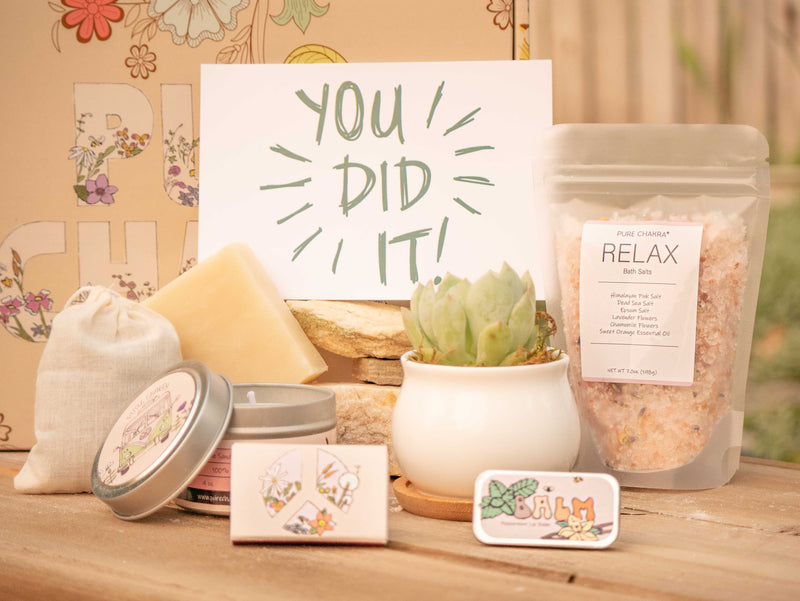 You did it! Succulent Gift Box with relax bath salt, natural soap, candle, custom matches, lavender sachet and lip balm, in front of a decorative gift box