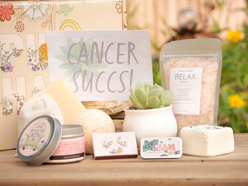 Cancer Succs! Succulent Gift Box with relax bath salt, natural soap, bath bomb, shower steamer, candle, custom matches, lavender sachet and lip balm, in front of a decorative gift box