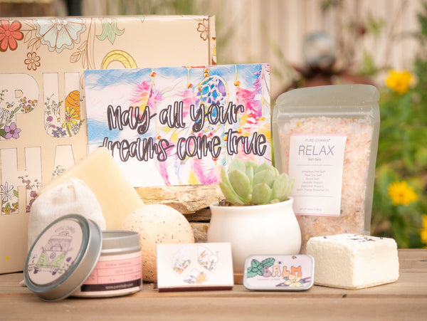 May all your dreams come true Succulent Gift Box with relax bath salt, natural soap, bath bomb, shower steamer, candle, custom matches, lavender sachet and lip balm, in front of a decorative gift box