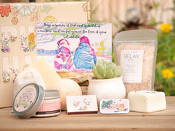 May memories of love and friendship maintain and comfort you in the loss of your beloved dog. Succulent Gift Box with relax bath salt, natural soap, bath bomb, shower steamer, candle, custom matches, lavender sachet and lip balm, in front of a decorative gift box