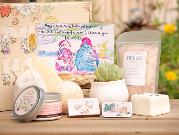 May memories of love and friendship maintain and comfort you in the loss of your beloved dog. Succulent Gift Box with relax bath salt, natural soap, bath bomb, shower steamer, candle, custom matches, lavender sachet and lip balm, in front of a decorative gift box