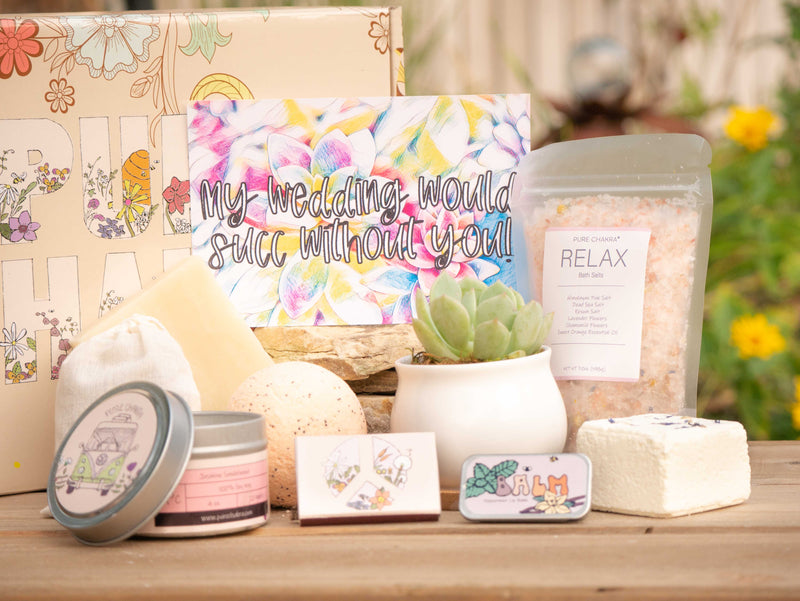 My wedding would succ without you! Succulent Gift Box with relax bath salt, natural soap, bath bomb, shower steamer, candle, custom matches, lavender sachet and lip balm, in front of a decorative gift box