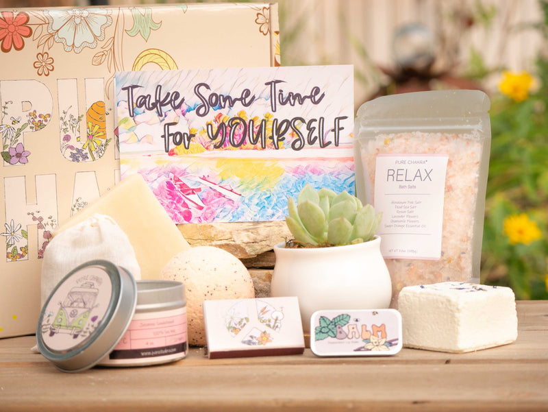 Take some time for yourself Succulent Gift Box with relax bath salt, natural soap, bath bomb, shower steamer, candle, custom matches, lavender sachet and lip balm, in front of a decorative gift box
