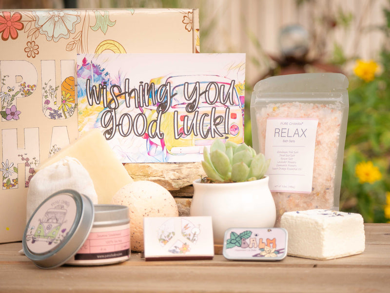 Wishing you good luck! Succulent Gift Box with relax bath salt, natural soap, bath bomb, shower steamer, candle, custom matches, lavender satchet and lip balm, in front of a decorative gift box