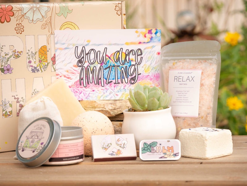 You are AMAZING Succulent Gift Box with relax bath salt, natural soap, bath bomb, shower steamer, candle, custom matches, lavender sachet and lip balm, in front of a decorative gift box
