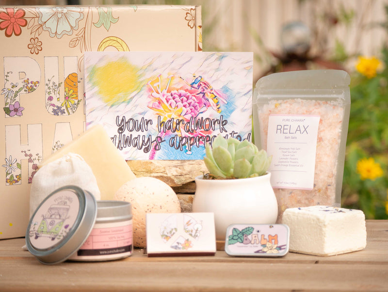 Your hard work is always appreciated Succulent Gift Box with relax bath salt, natural soap, bath bomb, shower steamer, candle, custom matches, lavender sachet and lip balm, in front of a decorative gift box