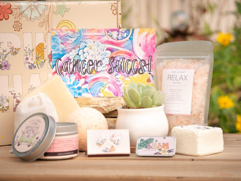 Cancer succs Succulent Gift Box with relax bath salt, natural soap, bath bomb, shower steamer, candle, custom matches, lavender sachet and lip balm, in front of a decorative gift box