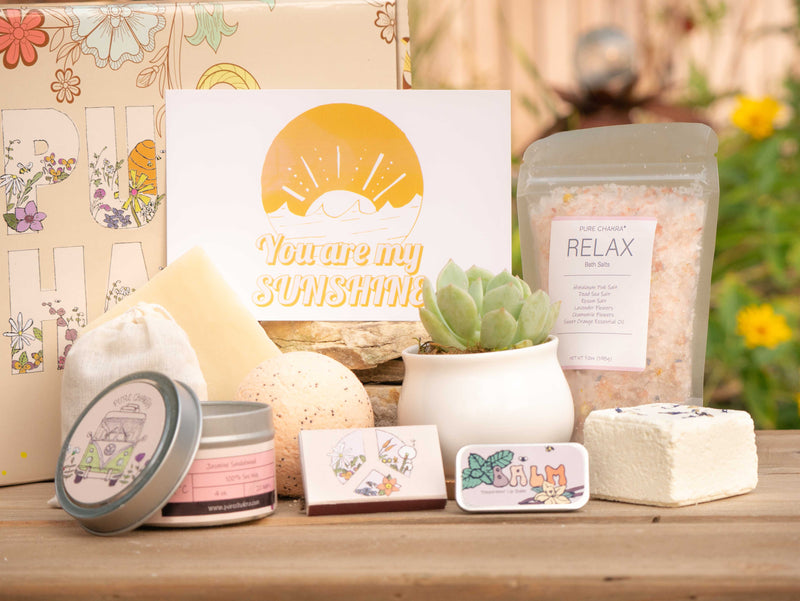 You are my sunshine Succulent Gift Box with relax bath salt, natural soap, bath bomb, shower steamer, candle, custom matches, lavender satchet and lip balm, in front of a decorative gift box