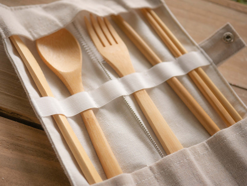 Bamboo cutlery set with butter knife, spoon, fork, chopsticks, straw and straw/pipe cleaner in a canvas carry case.
